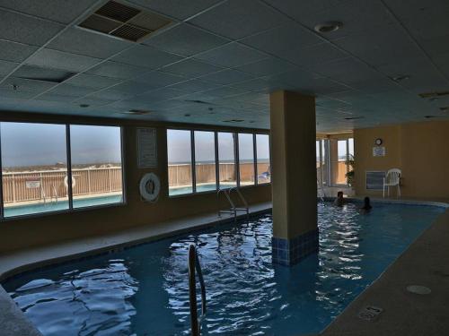 a swimming pool with a large swimming pool, Royal Palms 402 Condo in Gulf Shores (AL)