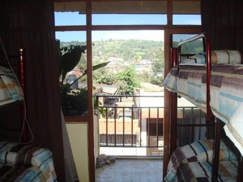 a room with a bunk bed and a window, Hostal El Eden in Zacatlan