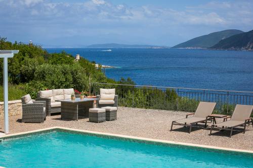 Swimming pool, Martini Waterfront Suites in Erisos