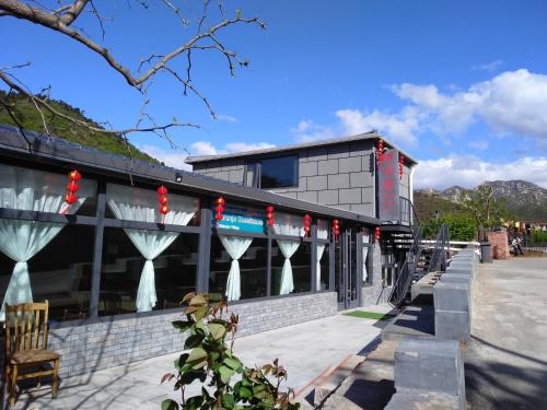 Exterior view, Huanghuacheng Water. Great Wall Derunju Guesthouse in Huairou District