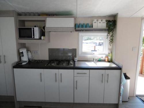 Chalet Joleen IJmuiden aan zee, vlakbij het strand in 艾默伊登