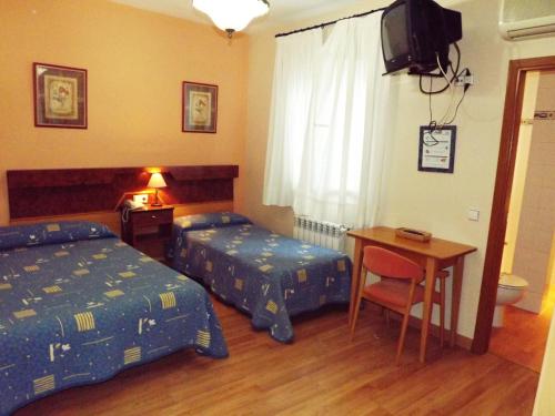 Hotel Castilla - Tap to explore photos