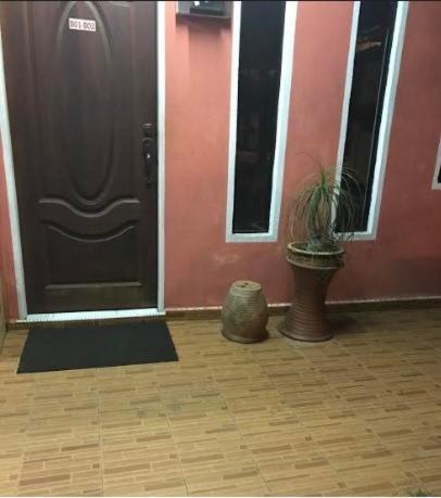 a fire hydrant sitting in front of a doorway, Trisya Homestay in Kuala Terengganu