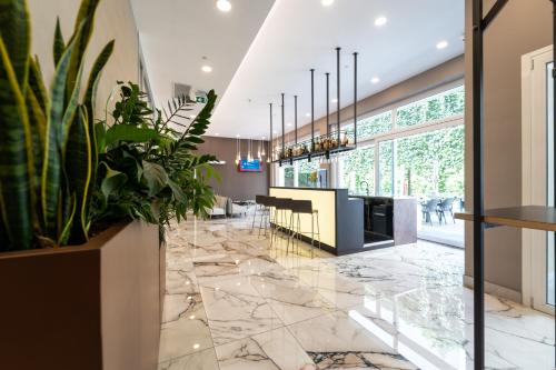 ห้องส่วนกลางสำหรับนั่งเล่น/ดูทีวี, โรงแรมมิลาโน กาสเตลโล (Hotel Milano Castello) near ปราสาทซฟอฟเซสโก