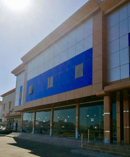 a building with a sign on the side of it, New Home Furnished Units in Yanbu