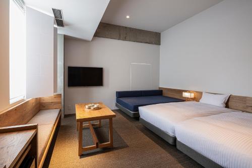 TSUGU Kyoto Sanjo by THE SHARE HOTELS - Tap to explore photos