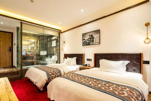 Deluxe Queen Room with Two Queen Beds room in Bliss Qintai Tibetan Boutique Hotel