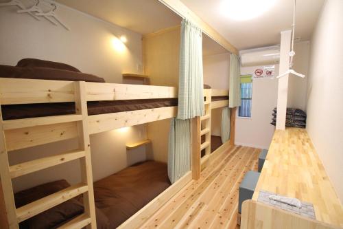 Bunk Bed in Male Dormitory Room with Shared Bathroom
