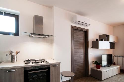 Kitchen, GuestHost - Fonte Laurentina Apartments in Other