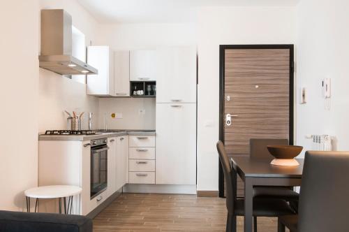 Kitchen, GuestHost - Fonte Laurentina Apartments in Other