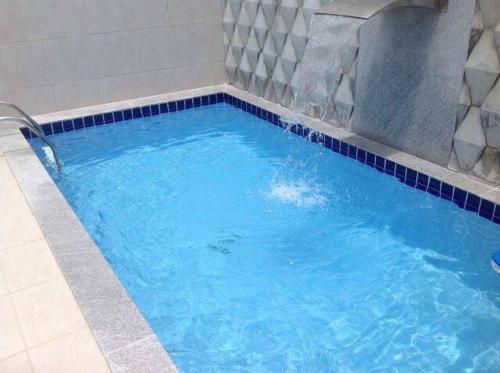 Confortavel apartamento com piscina 300mt da praia