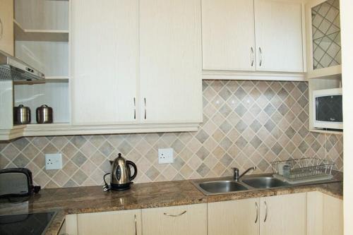 Kitchen, Uvongo Lucian Blue Flag Beach Apartment in Margate