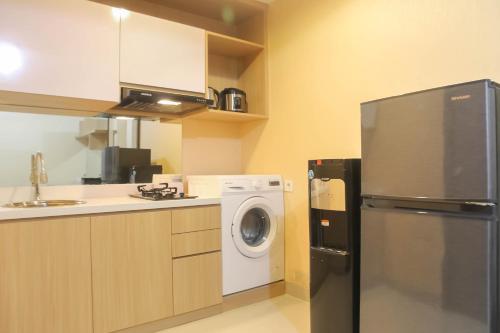 Spacious 1BR at The Oasis Cikarang Apartment By Travelio - image 2