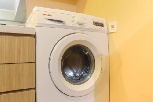 Spacious 1BR at The Oasis Cikarang Apartment By Travelio - image 4