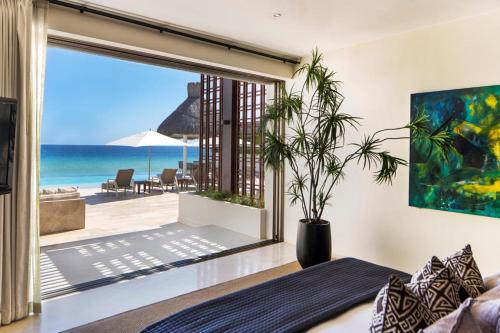 Ultra Exclusive Beachfront Villa Just Steps from the Sand with Butler Included