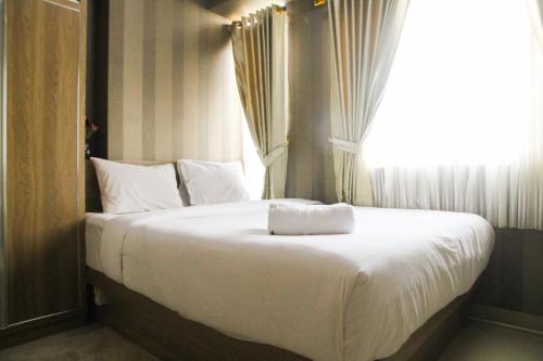 1BR with Extra Balcony The Oasis Cikarang Apartment By Travelio, Cikarang