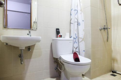 1BR with Extra Balcony The Oasis Cikarang Apartment By Travelio - image 4