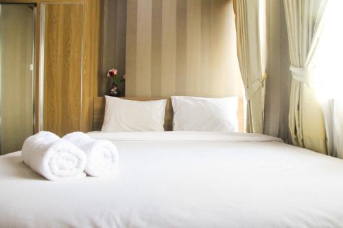 1BR with Extra Balcony The Oasis Cikarang Apartment By Travelio - image 3