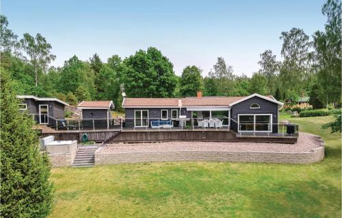 Stunning home in Boxholm with 4 Bedrooms, Sauna and WiFi