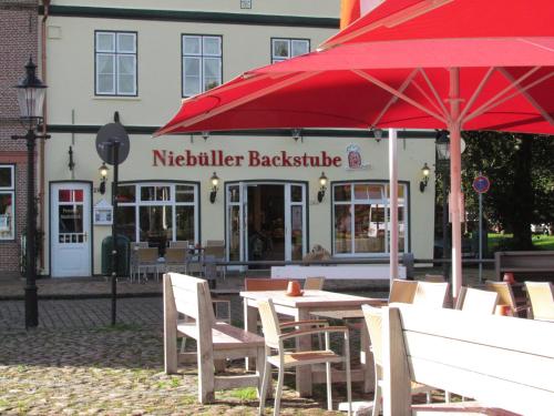 Étterem, Apartments im Froschhaus mit Fruhstuckskuchen in Friedrichstadt