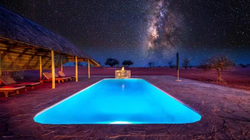 Swimming pool, Bagatelle Kalahari Game Ranch Resort in Mariental