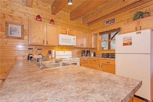 The Lodge at Caney Creek - Fire pit by the creek - Theater - Game Room - Hot Tub - main image