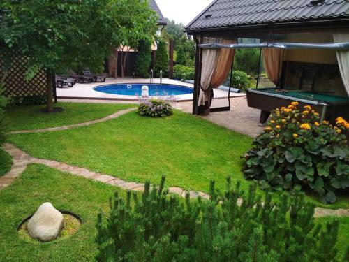 Eco-House PERI with a pool and in the garden near Kyiv