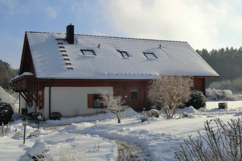 Heumanns Blockhaeuser am Wald