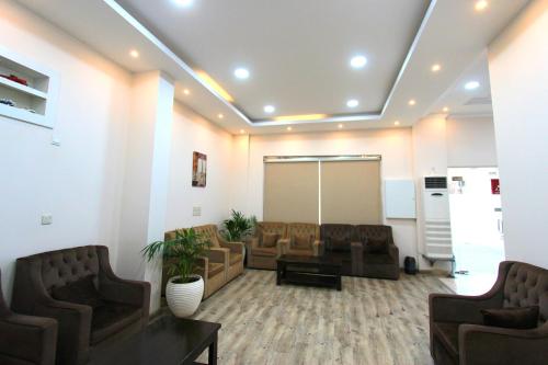 Shared lounge/TV area, شقق منازل القصواء للشقق المخدومة إقتصادي in An Naziyah
