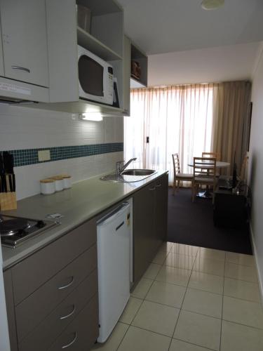 Kitchen, BASE Holidays - Ettalong Beach Premium Apartments in Central Coast