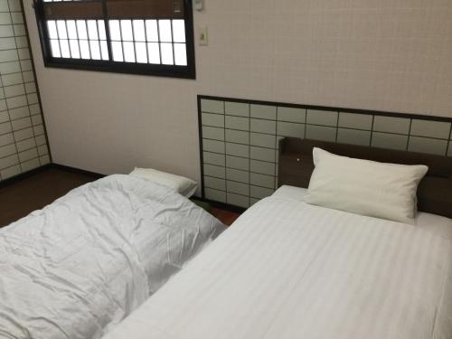 ゲストハウス & ホテル RA 鹿児島ルーム　シングルベッド　ソファベッド