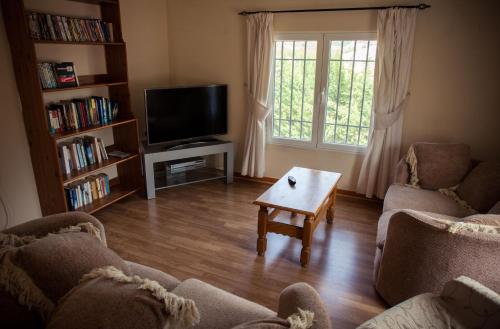 Koplietošanas atpūtas telpa ar TV, Casa Rural Rosa Blanca in El Cerezo