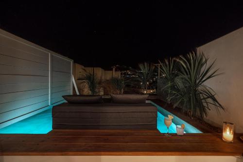Suite, junior, vue sur l’île, vue sur la piscine, piscine d’immersion
