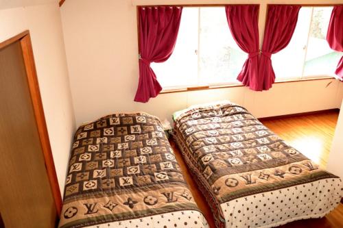 陽のあたる宿 サンセットパーム Room Type - Standard Twin Room with Sea View