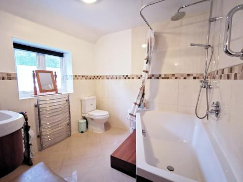Our beautiful large Suite room with a Double bath with Shower ensuite - It has a full Kitchen boasting stunning views over the Axe Valley - Only 3 miles from Lyme Regis, River Cottage HQ & Charmouth - Comes with free private parking