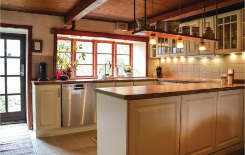 Kitchen, Three-Bedroom Holiday Home In Kirke Eskilstrup in Hvalso