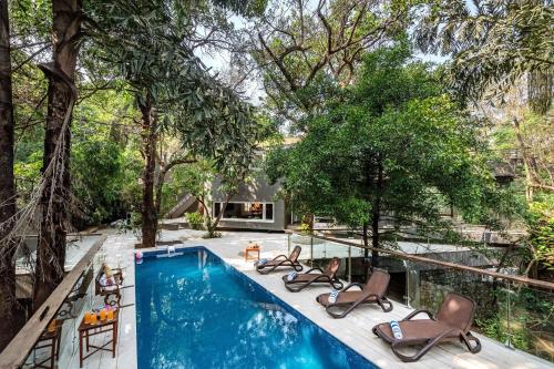 SaffronStays Odeon - art-deco heritage home with heated pool, private forest lawn and terrace