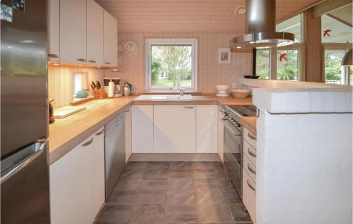 Kitchen, Three-Bedroom Holiday Home In Lundby in Lundby