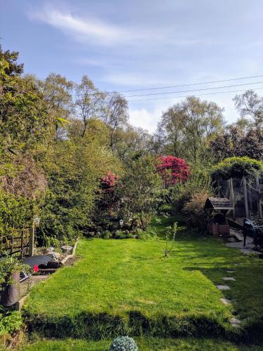 Our beautiful large Suite room with a Double bath with Shower ensuite - It has a full Kitchen boasting stunning views over the Axe Valley - Only 3 miles from Lyme Regis, River Cottage HQ & Charmouth - Comes with free private parking