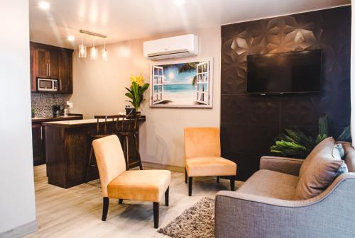 gedeelde lounge/tv-ruimte, Barefoot Caye Caulker Hotel in Caye Caulker