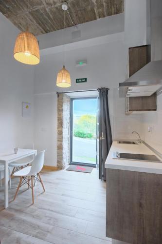 Kitchen, APARTAMENTOS LA LLONGAR in Pilona