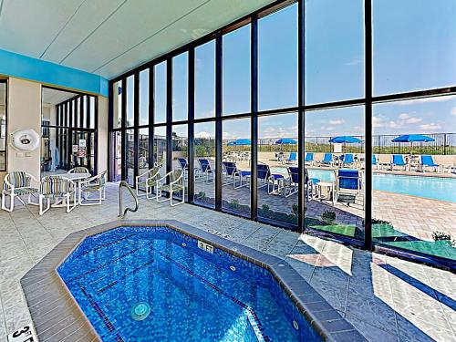 New Listing! Enchanting Corner Unit with Gym & Pools condo - image 6