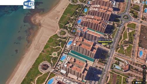Exterior view of Apartamento 1ª Linea de mar en Marina d'Or con cesped y playa [Familiar]