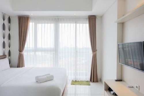 Homey and Comfy Studio Casa De Parco Apartment By Travelio – Tangerang, PA
