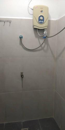 a shower stall with a hose attached to it, PERINTIS MOTEL in Langkawi