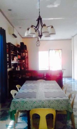 a dining room table and chairs in a room, Lindstrom's Inn in Bohol