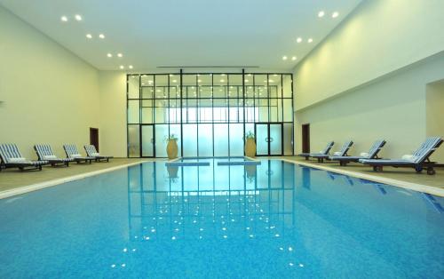 Ramada Hotel & Suites by Wyndham Ajman - Tap to explore photos