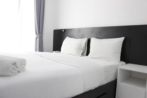 Monochrome Style Studio Room @Grand Asia Afrika Apartment By Travelio, Bandung