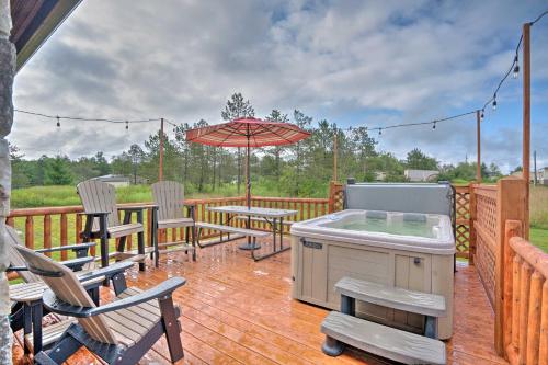 Rustic Benezette Cabin with Porch, Hot Tub and Fire Pit