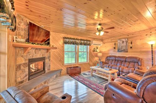 Rustic Benezette Cabin with Porch, Hot Tub and Fire Pit